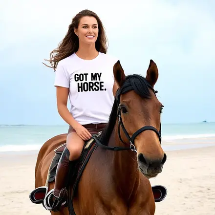 woman riding her horse with tee shirt saying Got My Horse